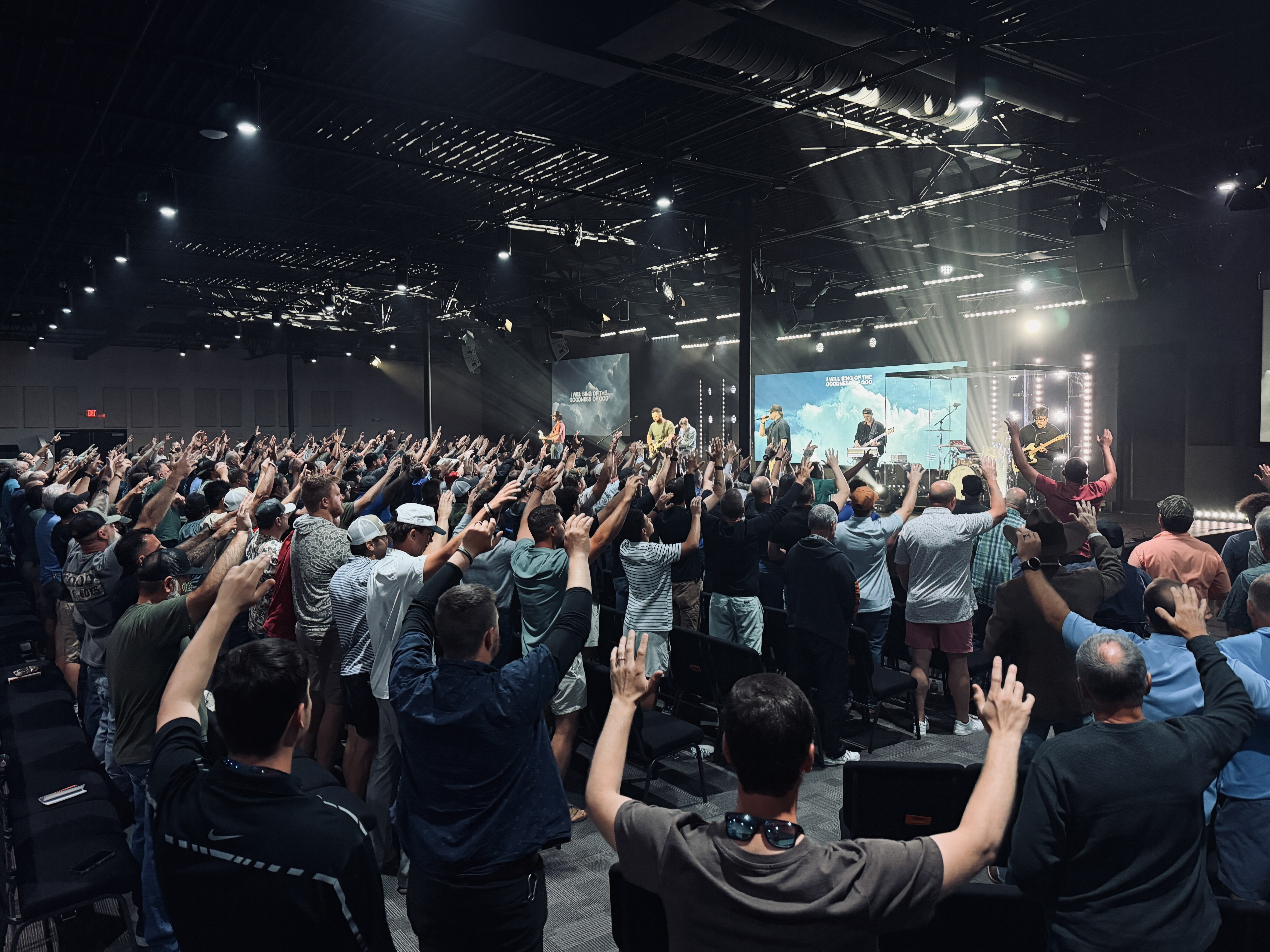 Men's room raising hands worshiping